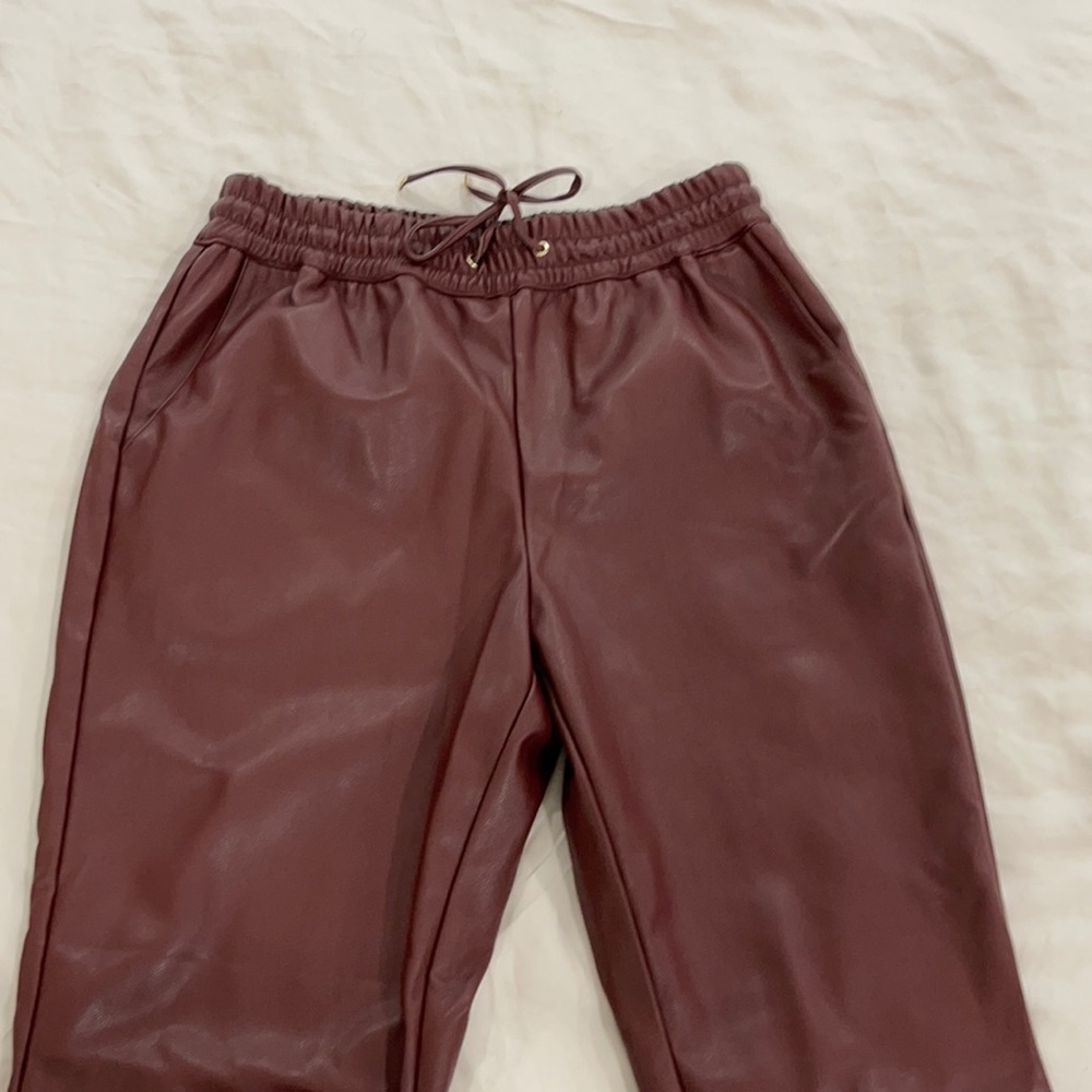 Burgundy faux leather pants